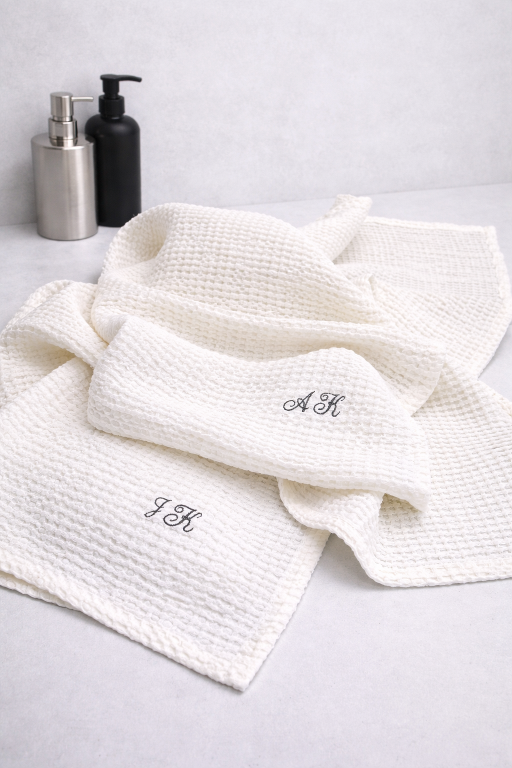 White linen cotton waffle towel with embroidered initials
