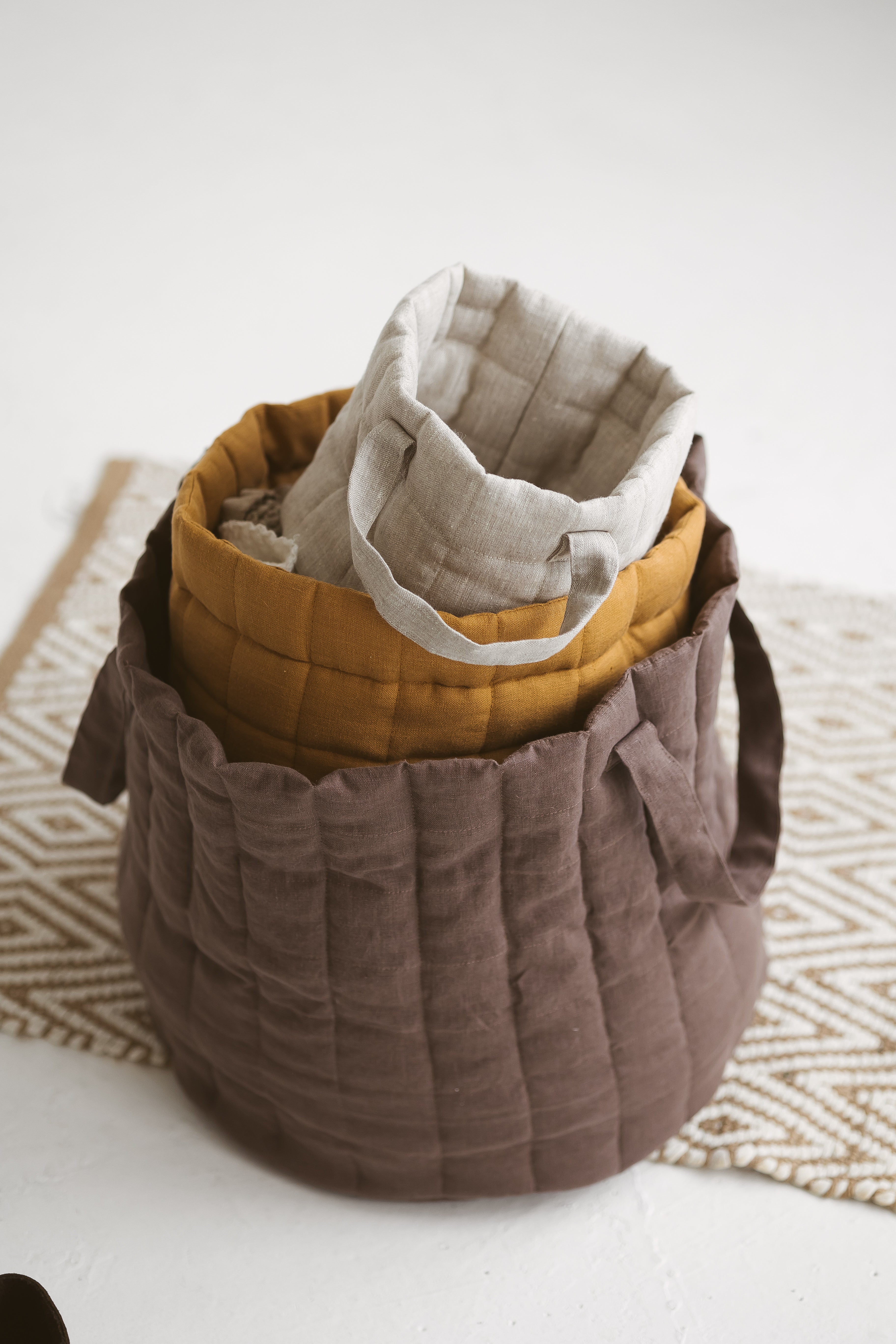 brown quilted linen laundry basket