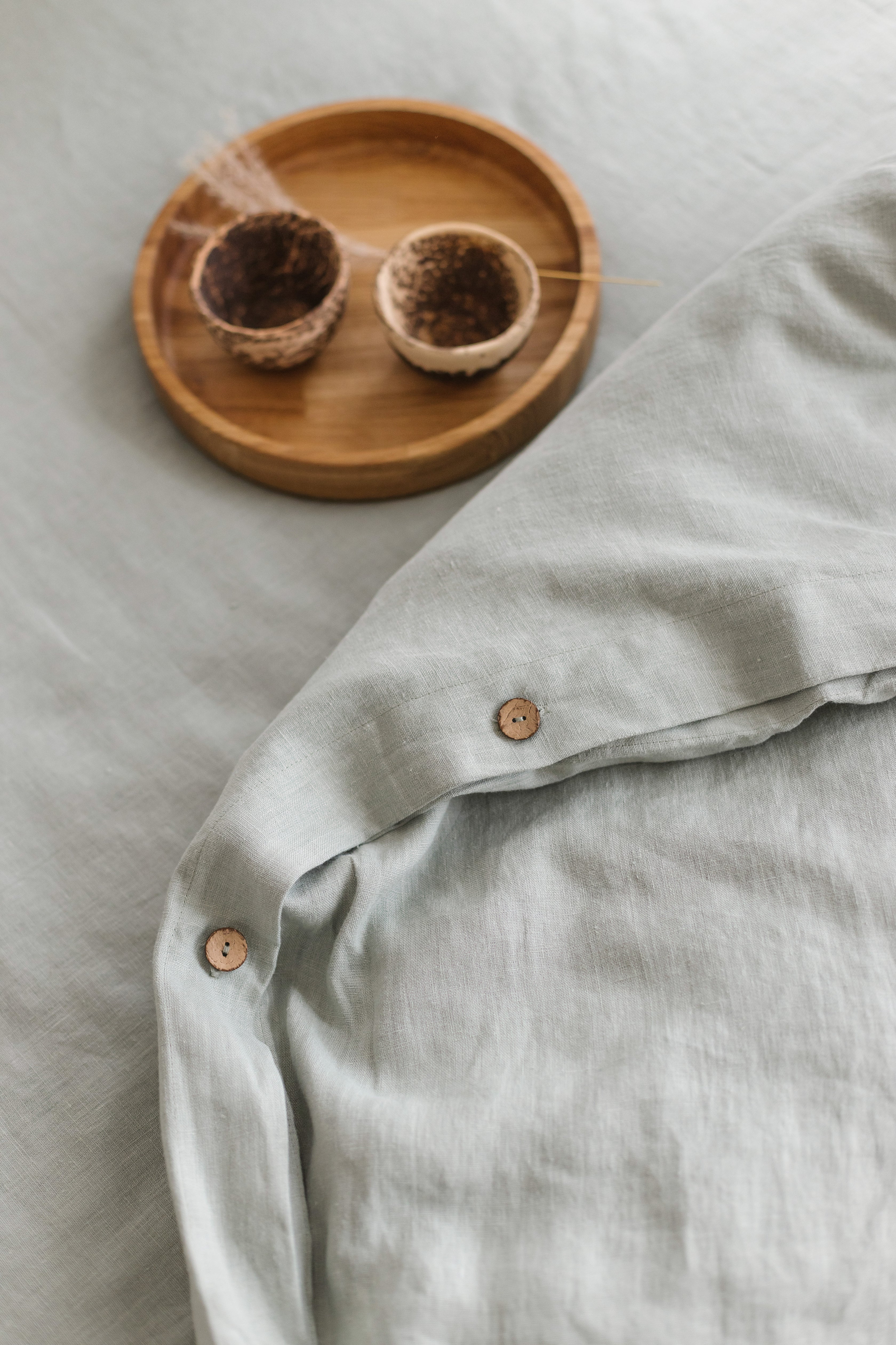 Sage linen bedding set with buttons