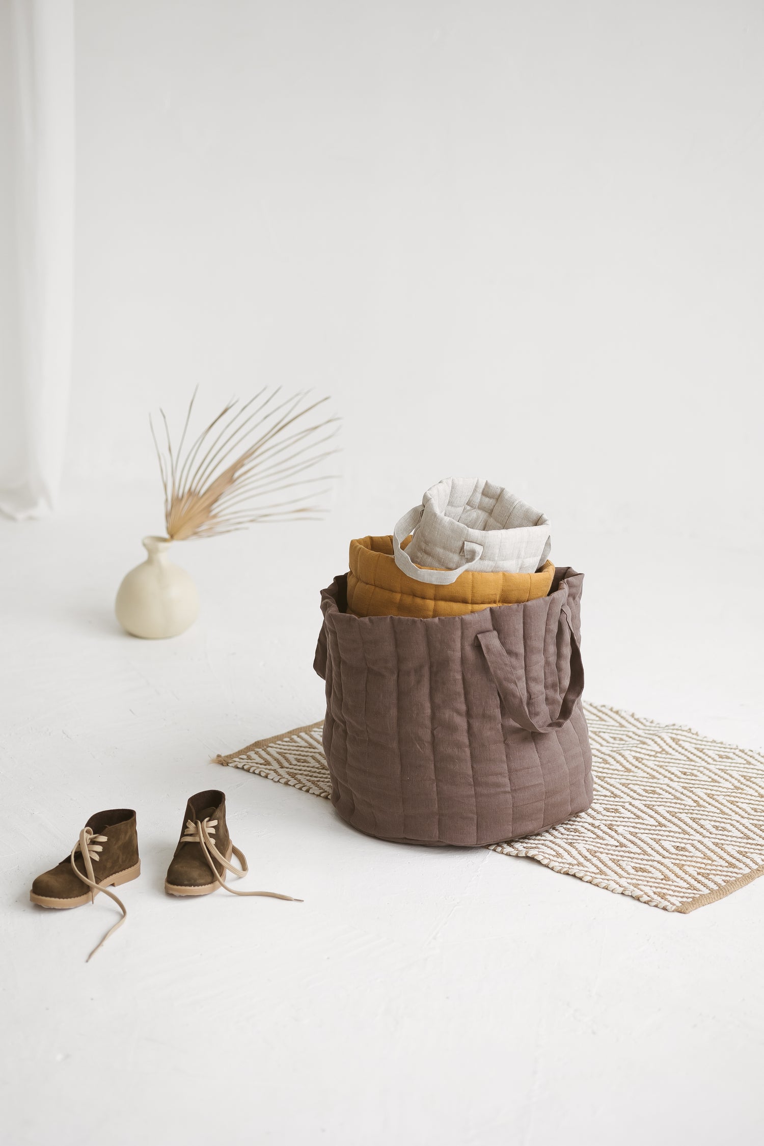 brown quilted linen laundry basket