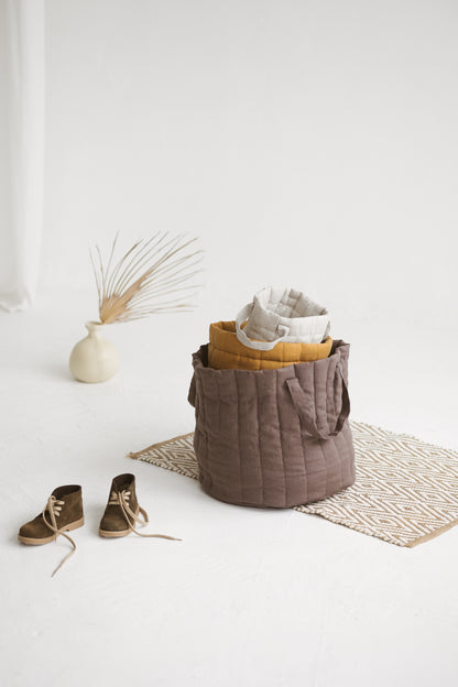 brown quilted linen laundry basket