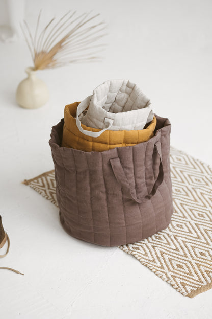 brown quilted linen laundry basket