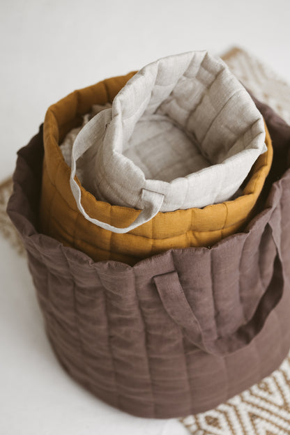 brown quilted linen laundry basket