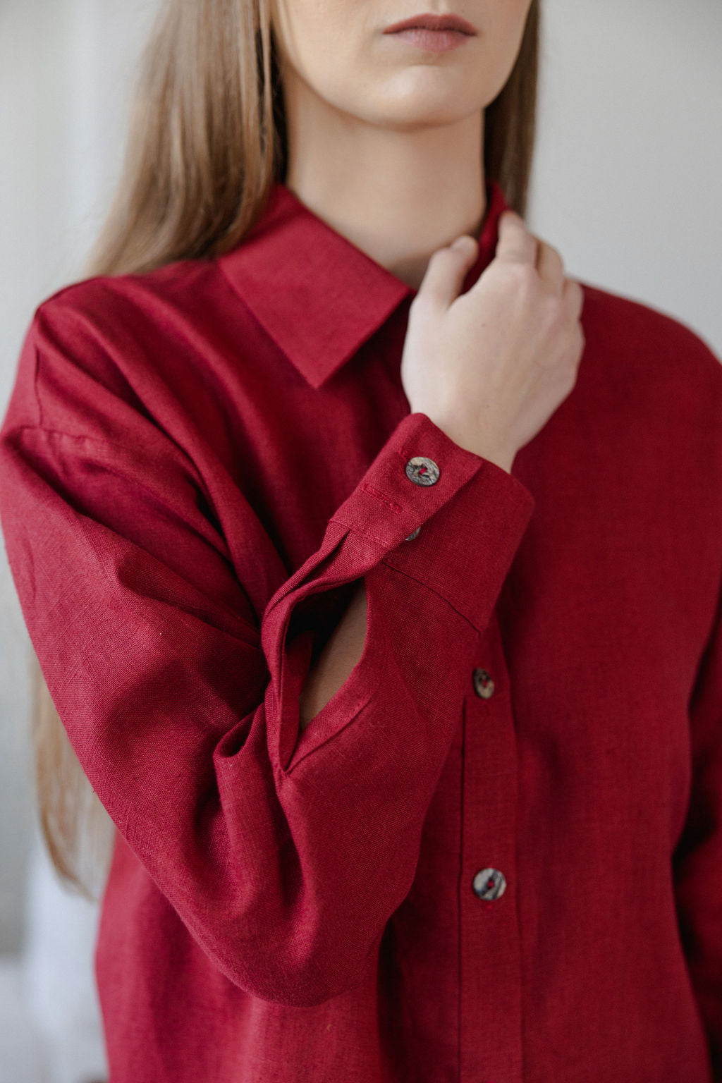 Red shirt worn by a person with a blurred background