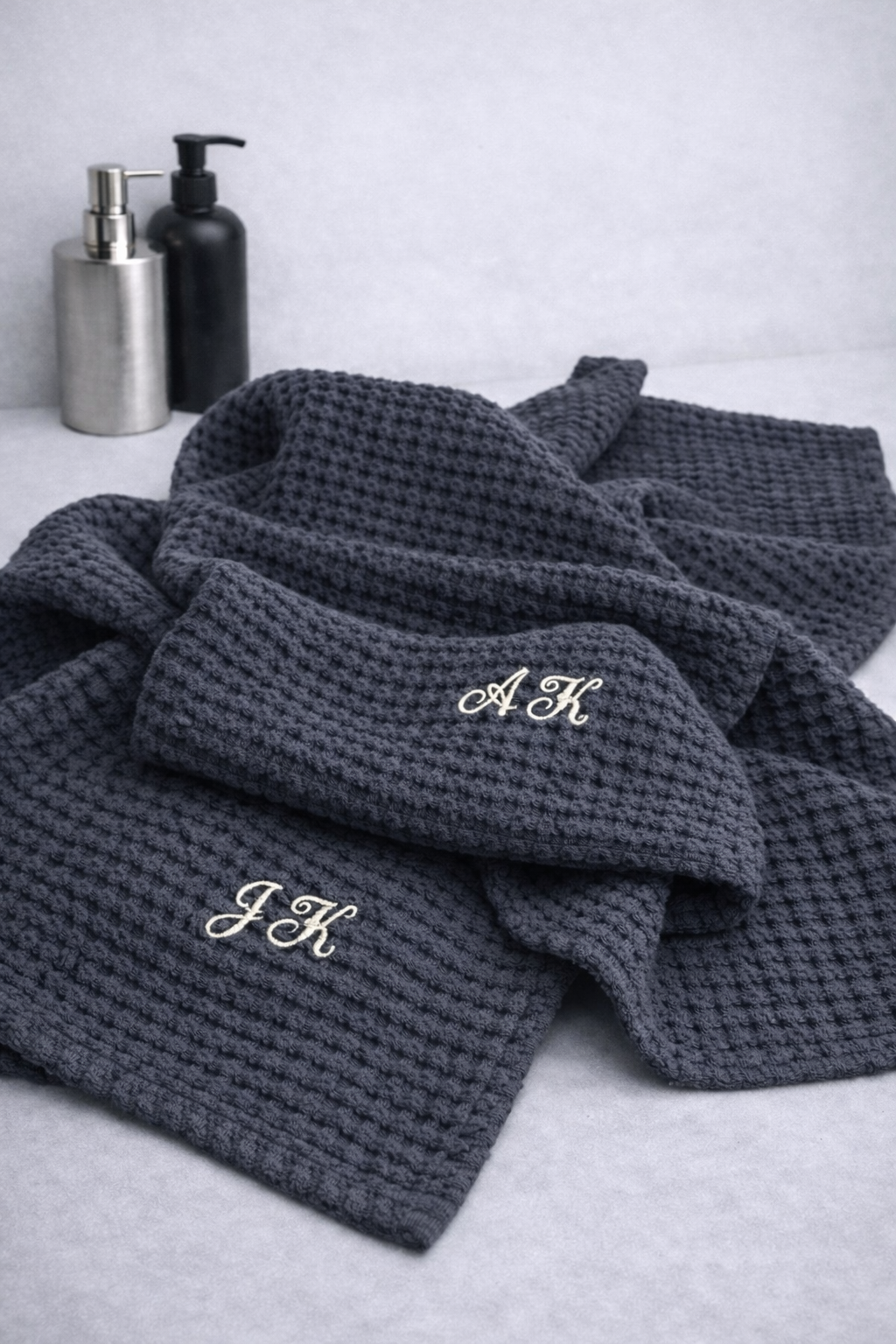 Dark gray textured linen cotton towel with a monograme