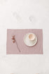 Pink linen placemat.